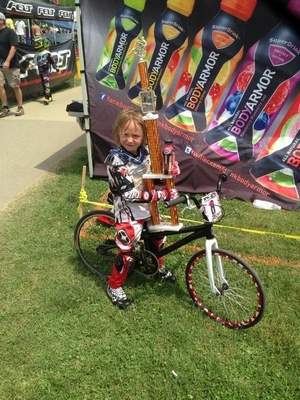  Five-year-old BMX racer Cassidy Hall holding her trophy after finishing first in her age group at the East Coast BMX Nationals in Maryland in June. / Photo courtesy of John Hall